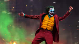 Joker Acting Suit In Front Of City Wallpaper