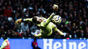 Jordan Pickford Jumping Towards Football Wallpaper