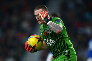 Jordan Pickford Pointing To His Temple Wallpaper