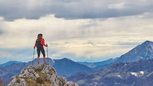 Journey Of Woman Standing On Rock Wallpaper