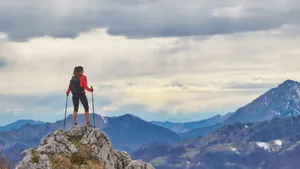 Journey Of Woman Standing On Rock Wallpaper