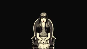 Junji Ito's Character Tomie Kawakami Lounging On A Chair Wallpaper