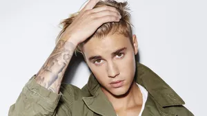 Justin Bieber In Green Jacket Wallpaper