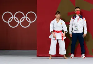 Karate Kid And Coach At Olympics Wallpaper