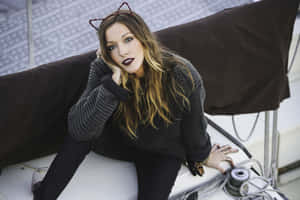 Katie Cassidy Striking A Pose In A Stunning Portrait Wallpaper