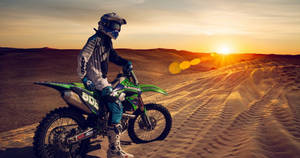 Kawasaki Bike In Dakar Rally Wallpaper