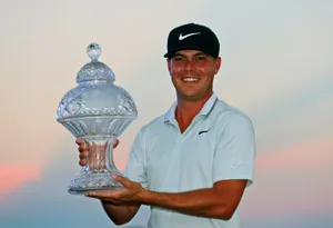 Keith Mitchell Holding A Trophy Wallpaper