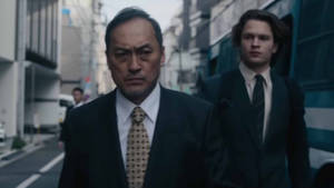 Ken Watanabe And Ansel Elgort In A Riveting Scene From The Movie, Tokyo Vice. Wallpaper