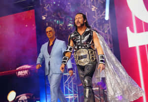 Kenny Omega Walking With Don Callis Wallpaper