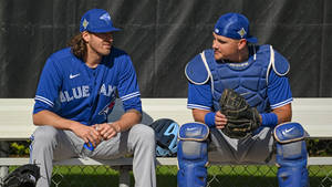 Kevin Gausman Toronto Blue Jays Sitting In A Bench Wallpaper