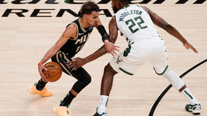 Khris Middleton Vs. Trae Young Wallpaper