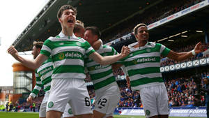 Kieran Tierney Celebrating With Team Wallpaper