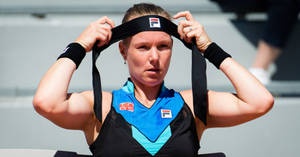 Kiki Bertens Getting Ready For A Match, Putting A Headband On Wallpaper