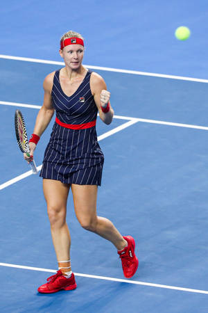 Kiki Bertens Sporting A Chic Striped Fila Dress On The Tennis Court Wallpaper