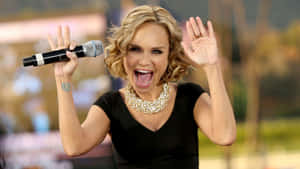 Kristin Chenoweth Radiant In A Silver Dress Wallpaper