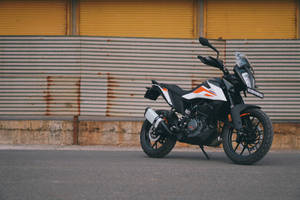 Ktm Bike On Pavement Wallpaper