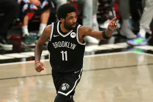 Kyrie Irving In Action For The Brooklyn Nets Wallpaper