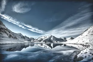 Lake Reflects Mountain In Cool Winter Wallpaper