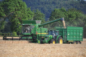 Large John Deere Machine In Field Wallpaper