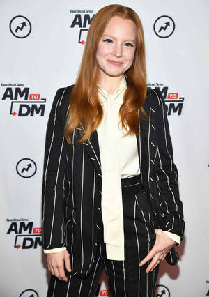 Lauren Ambrose In A Striped Suit Wallpaper