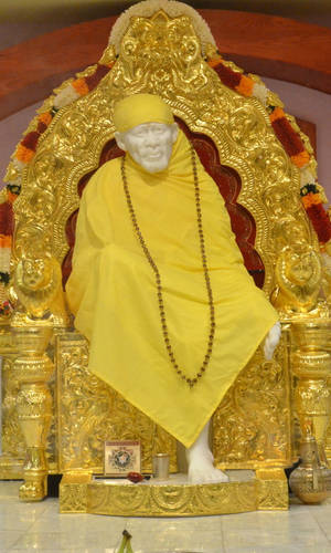 Lavish Gold Throne Sai Baba Phone Wallpaper