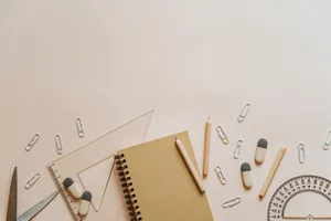 Learning Materials On Cream-colored Desk Wallpaper