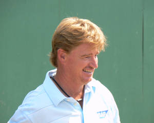 Legendary Golfer Ernie Els Smiling At An Event Wallpaper