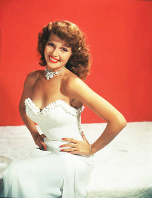 Legendary Hollywood Star Rita Hayworth In White Bustier Dress Wallpaper