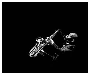 Legendary Jazz Saxophonist Sonny Rollins In Performance Wallpaper