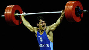 Legendary Pyrros Dimas Weight Lifting Moment Wallpaper