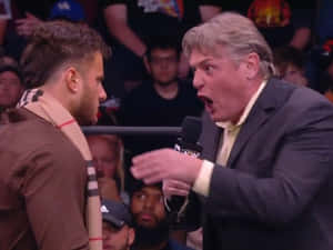 Legendary William Regal And Maxwell Jacob Friedman In An Intense Wwe Moment. Wallpaper