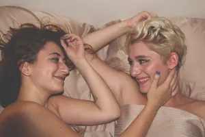 Lesbian Couple On Bed Wallpaper