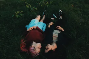 Lesbian Lying On Field Wallpaper