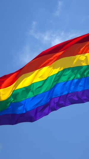 Lgbt Flag Over The Blue Sky Iphone Wallpaper