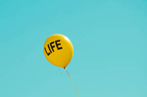 Life Word In Yellow Balloon Wallpaper