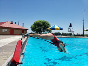 Lifeguard Training Drill For Deep Water Rescue Wallpaper