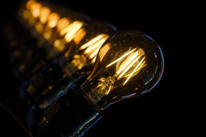 Light Bulbs With Golden Filaments Wallpaper