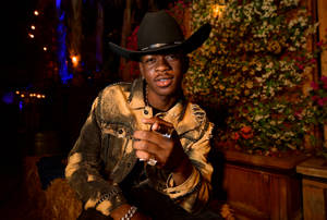 Lil Nas X Beige Cowboy Outfit Wallpaper