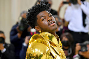 Lil Nas X Gold Armor Outfit Wallpaper