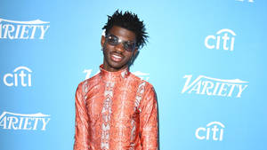 Lil Nas X Standout Outfit Wallpaper