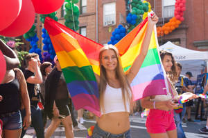 Lipstick Lesbian Girl Walking With Flag Wallpaper