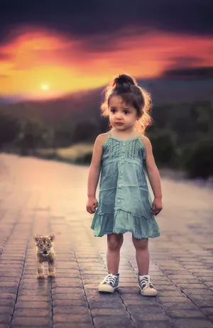 Little Girl Child With Tiger Cub Wallpaper