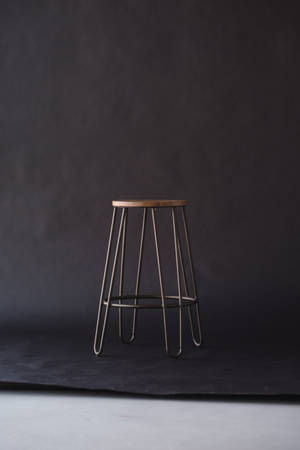Lonely Wooden Stool With Black Background Wallpaper
