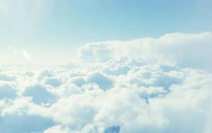 Looking Up To The Clouds For A Moment Of Peace Wallpaper