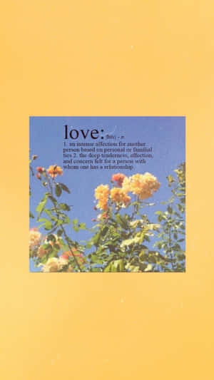 Love - A Yellow Card With A Quote On It Wallpaper