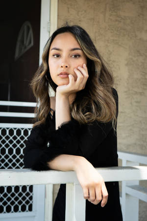 Lovely Girl On White Railing Wallpaper