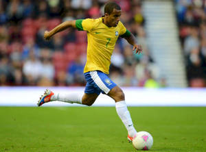 Lucas Moura Kicking Football On Field Wallpaper