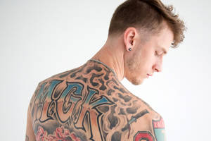 Machine Gun Kelly In Gray Wallpaper