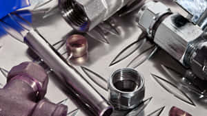 Macro Metal Pipe And Plumbing Fittings Wallpaper