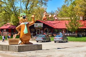 Magnificent Statue Of Yogi Bear In Jellystone National Park Wallpaper